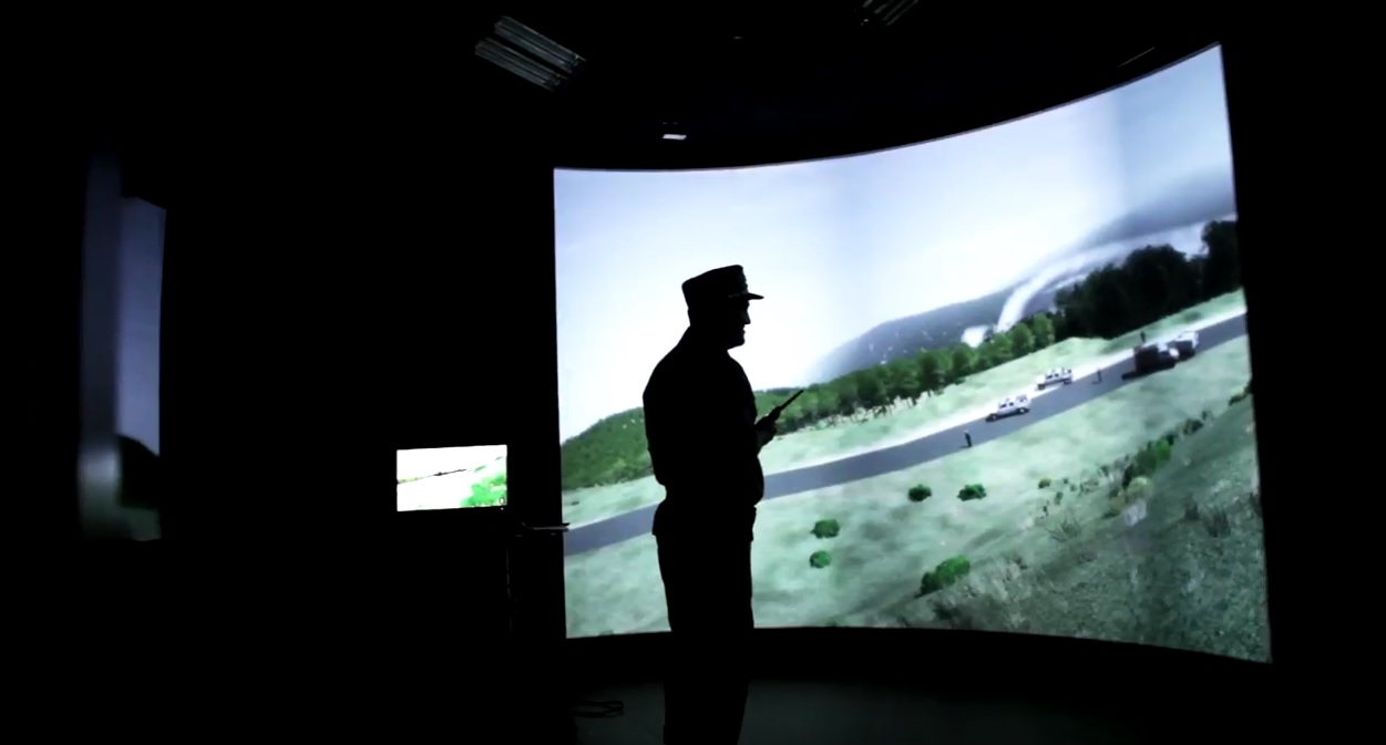 The simulator features an immersion room with 3m by 8m screen display