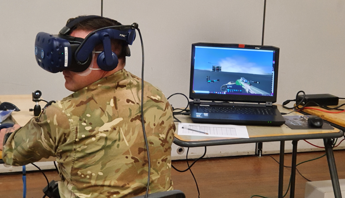 Using a VR headset, a forward observer views the effects of smoke dropped by mortars. Image courtesy Minerva Training &amp; Simulation.